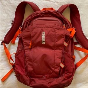 Thule red backpack
